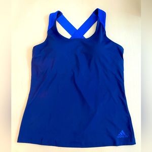 New without tags. Womens Adidas Athletic tank. Cross straps, build in bra. Sz M